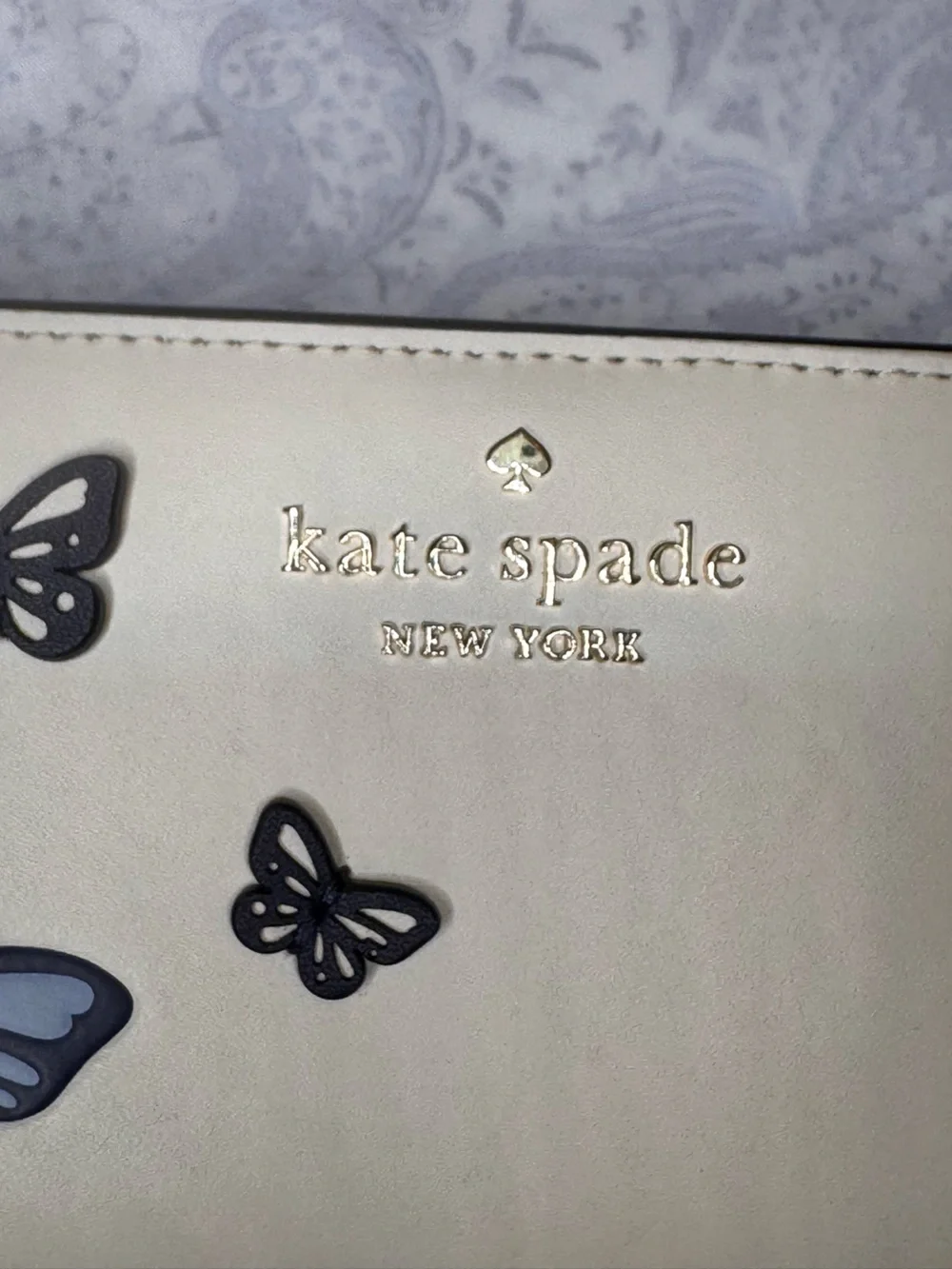 kate spade cream zip